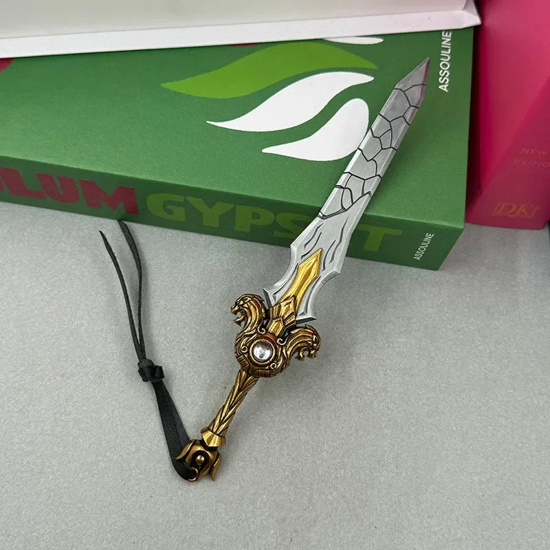Anime-style zinc alloy sword replica with gold handle, displayed on a tabletop near books