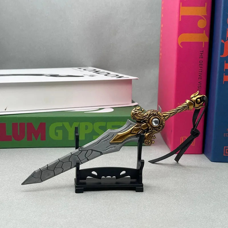 Anime-style zinc alloy sword replica with gold accents on a stand, displayed with books