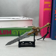 Anime-style zinc alloy sword replica with gold accents on a stand, displayed with books