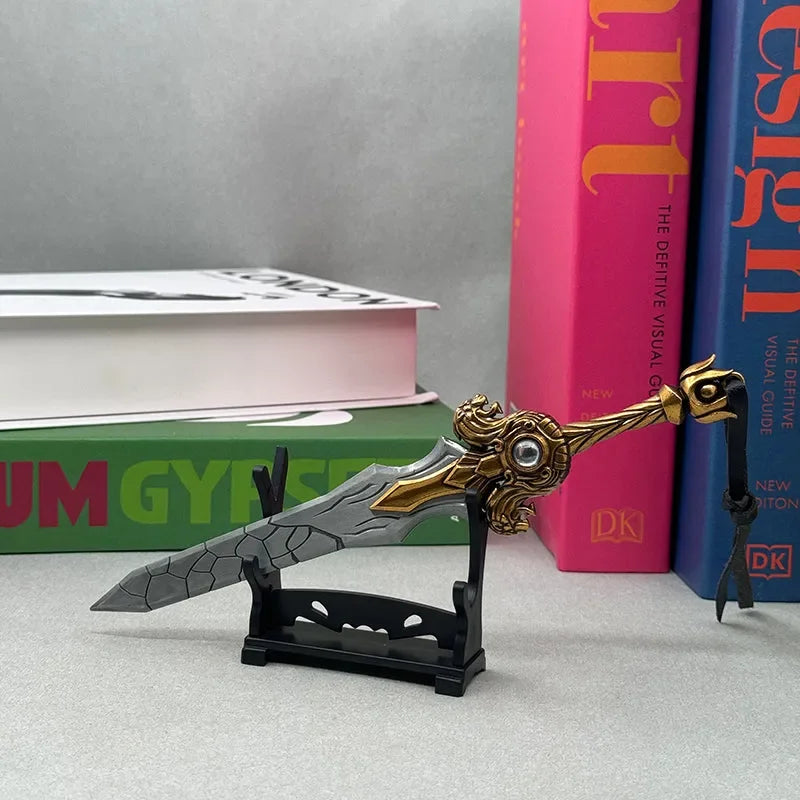 Anime-style zinc alloy sword replica with gold and silver detailing on display stand, books in background