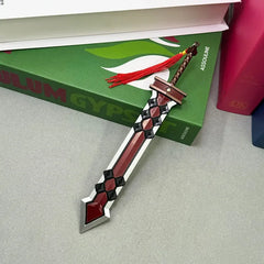 1:6 anime-style zinc alloy sword replica with red and black design on a desk near books