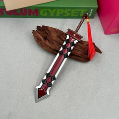 Anime-style zinc alloy sword replica with red tassel on wood, BlacksmithSONG collectible.