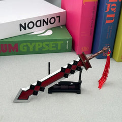 1:6 scale anime-style zinc alloy sword replica with red tassel on display, books in background