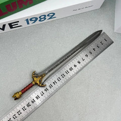 1:6 anime-style zinc alloy replica sword with detailed hilt beside a ruler on tabletop