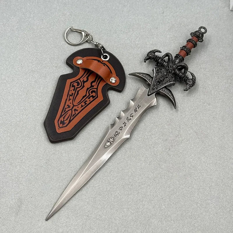 Anime-style zinc alloy sword replica with ornate black hilt and decorative sheath keychain.