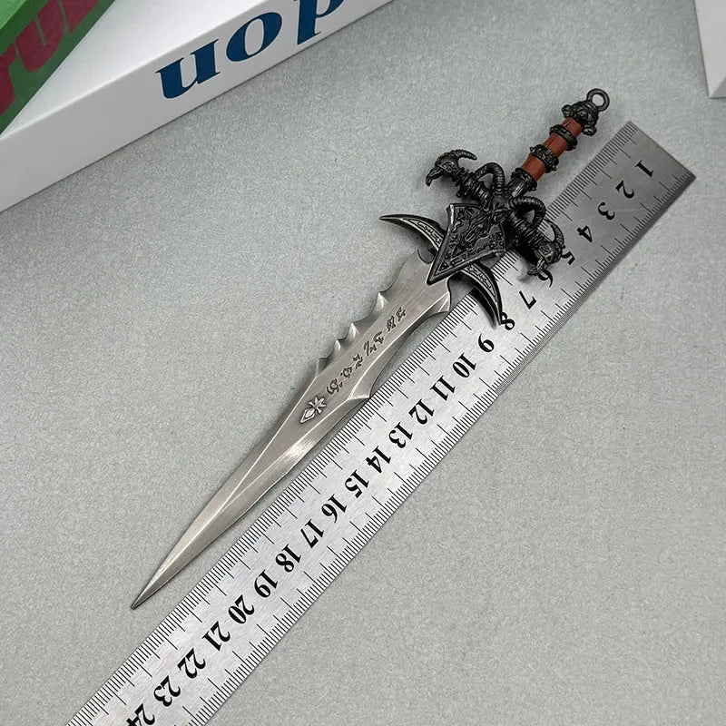 Anime-style zinc alloy sword replica with ornate handle, placed next to a ruler for scale.
