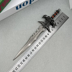 Anime-style zinc alloy sword replica with ornate handle, placed next to a ruler for scale.