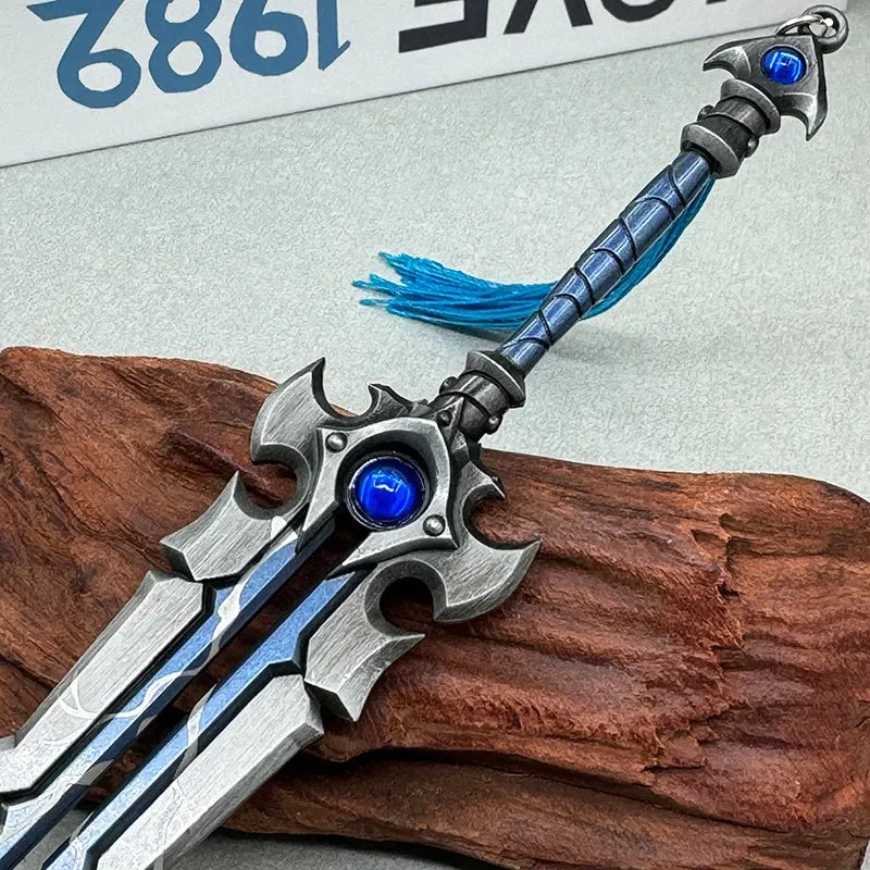 Anime-style zinc alloy sword replica with blue gem and tassel, collectible cosplay weapon