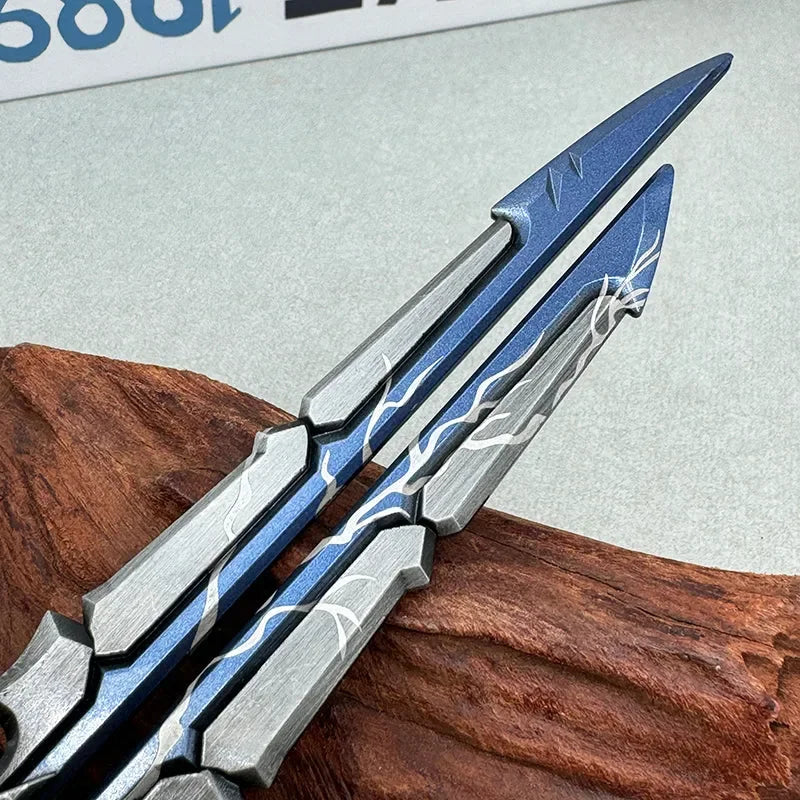 Anime-style zinc alloy replica dagger with blue and silver detailing on wooden stand