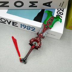 Anime-style zinc alloy collectible sword replica with red tassel, displayed on books.