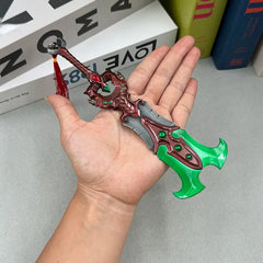 Hand holding a 1:6 anime-style zinc alloy sword replica with green and red accents, BlacksmithSONG collectible.