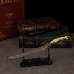 Gold-Hilt Serrated Katana replica — on the small display stand.