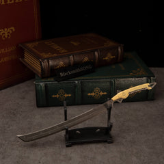 Gold-Hilt Serrated Katana replica — on the large display stand.