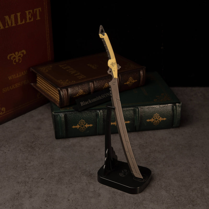 Gold-Hilt Serrated Katana replica — on the vertical display stand.