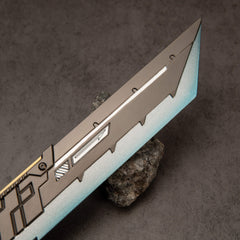 Buster Sword R5 replica — blade close-up: gunmetal panel and silver-to-teal edge.