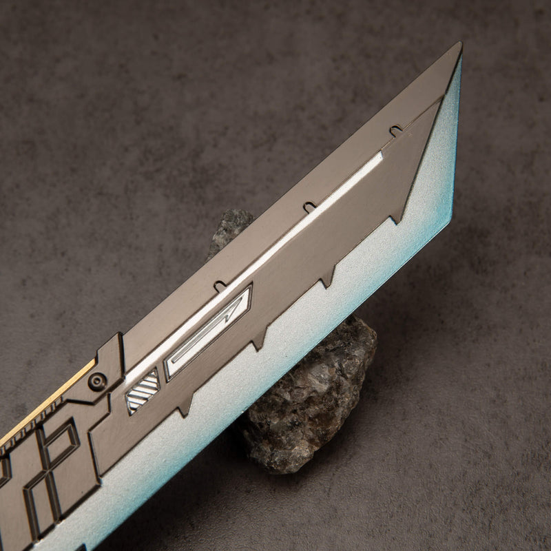 Buster Sword R5 replica — blade close-up: gunmetal panel and silver-to-teal edge.