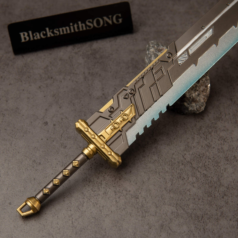 Buster Sword R5 replica — hilt close-up: gold crossguard and diamond-studded dark grip.