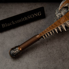 Patu replica — close-up of the braided-wrap grip and sculpted pommel.