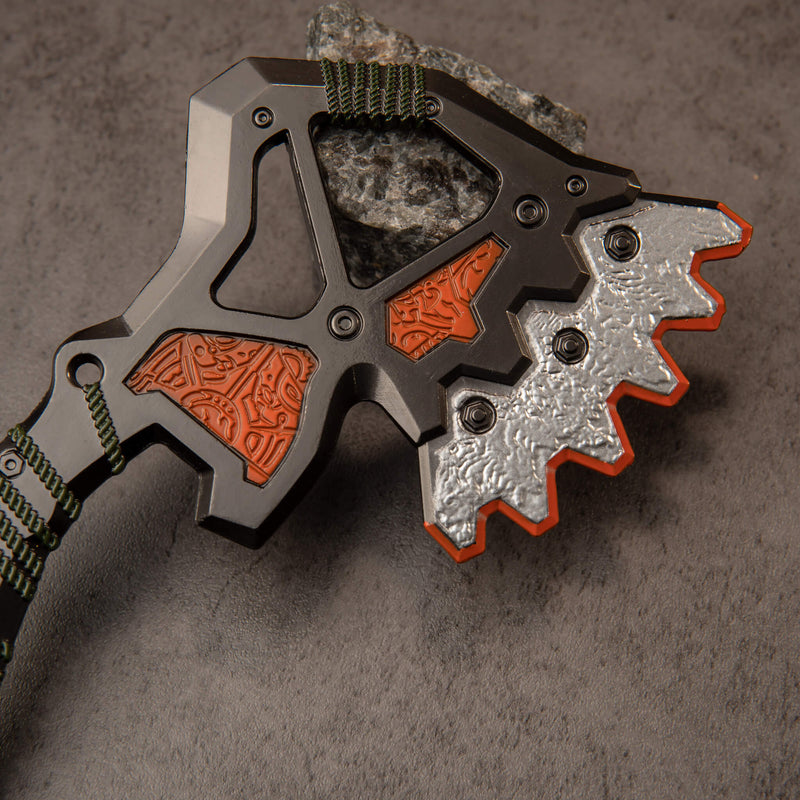War Club replica — close-up of the open lattice frame, copper-orange panels and serrated silver crest.