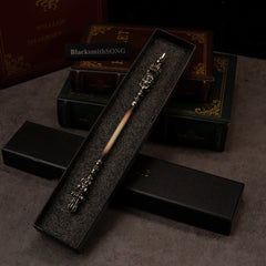 Chitin Staff replica — laid inside its black gift box.
