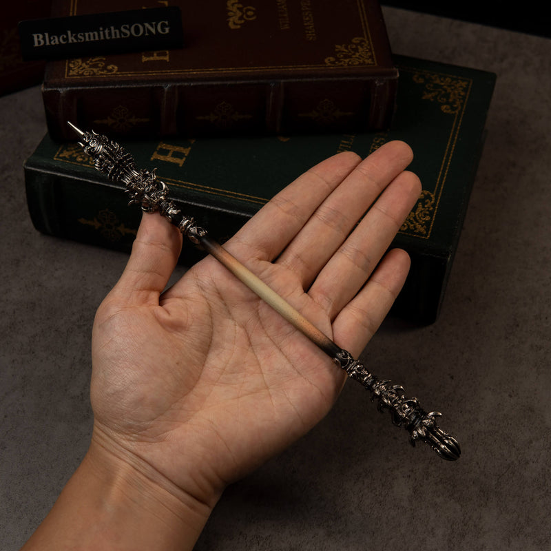 Chitin Staff replica (22cm die-cast zinc alloy staff) — held in hand for scale.