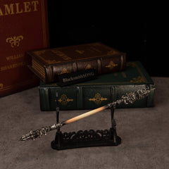 Chitin Staff replica — resting on the large display stand.