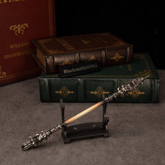 Chitin Staff replica — resting on the small display stand.