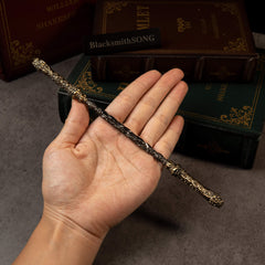 Cloud-Patterned Stone Staff replica (22cm die-cast zinc alloy rod) — held in hand for scale.