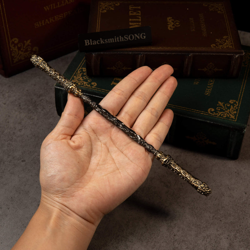 Cloud-Patterned Stone Staff replica (22cm die-cast zinc alloy rod) — held in hand for scale.