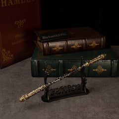 Cloud-Patterned Stone Staff replica — resting on the large display stand.
