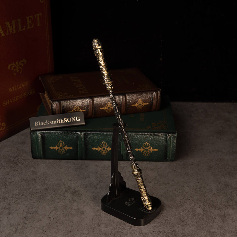Cloud-Patterned Stone Staff replica — standing on the vertical display stand.