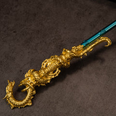 Golden Loong Staff replica — close-up of the matte-gold dragon relief and scale texture.