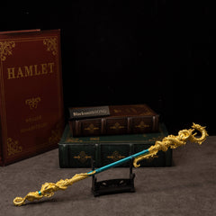 Golden Loong Staff replica — displayed on the small stand.