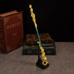 Golden Loong Staff replica — displayed upright on the vertical stand.