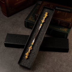 Loongwreathe Staff replica — resting in its black foam-lined gift box.