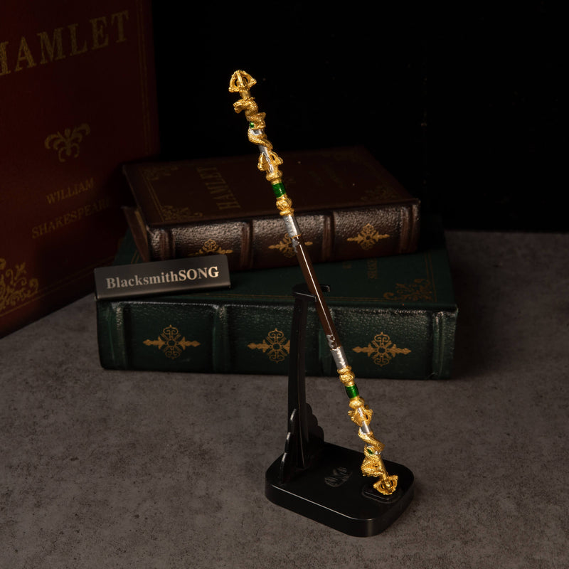 Loongwreathe Staff replica — standing upright on the vertical display stand.