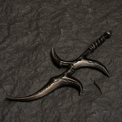 Black Knife metal replica from Elden Ring isolated on a dark grey textured background, showing its warped blade design.