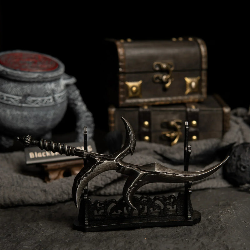Black Knife displayed horizontally on a large black stand with a warrior jar pot prop in the background.