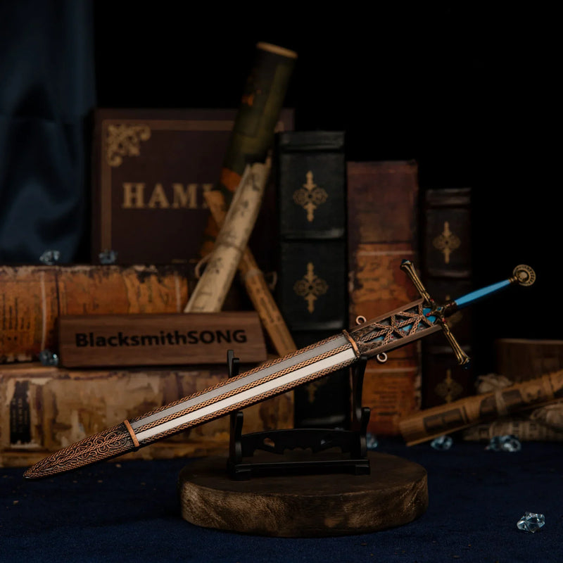 Carian Knight's Sword displayed on a small, simple horizontal stand against blue velvet.