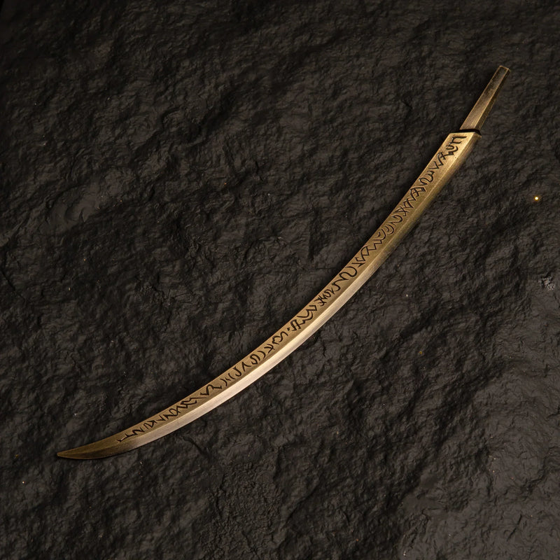 Hand of Malenia katana metal replica isolated on a black background, showing the long curved blade.