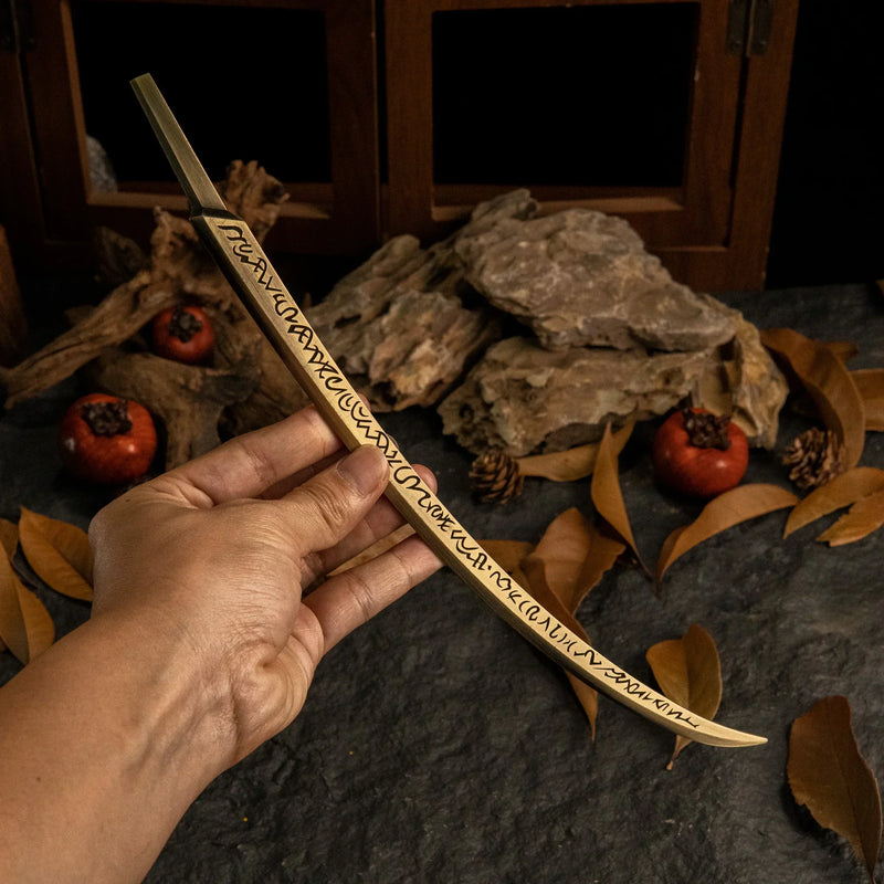 A hand holding the extra-long 30cm Hand of Malenia replica to show its impressive scale.