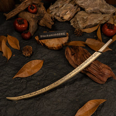 High-angle view of the Hand of Malenia sword on a textured rock surface with fall leaves.