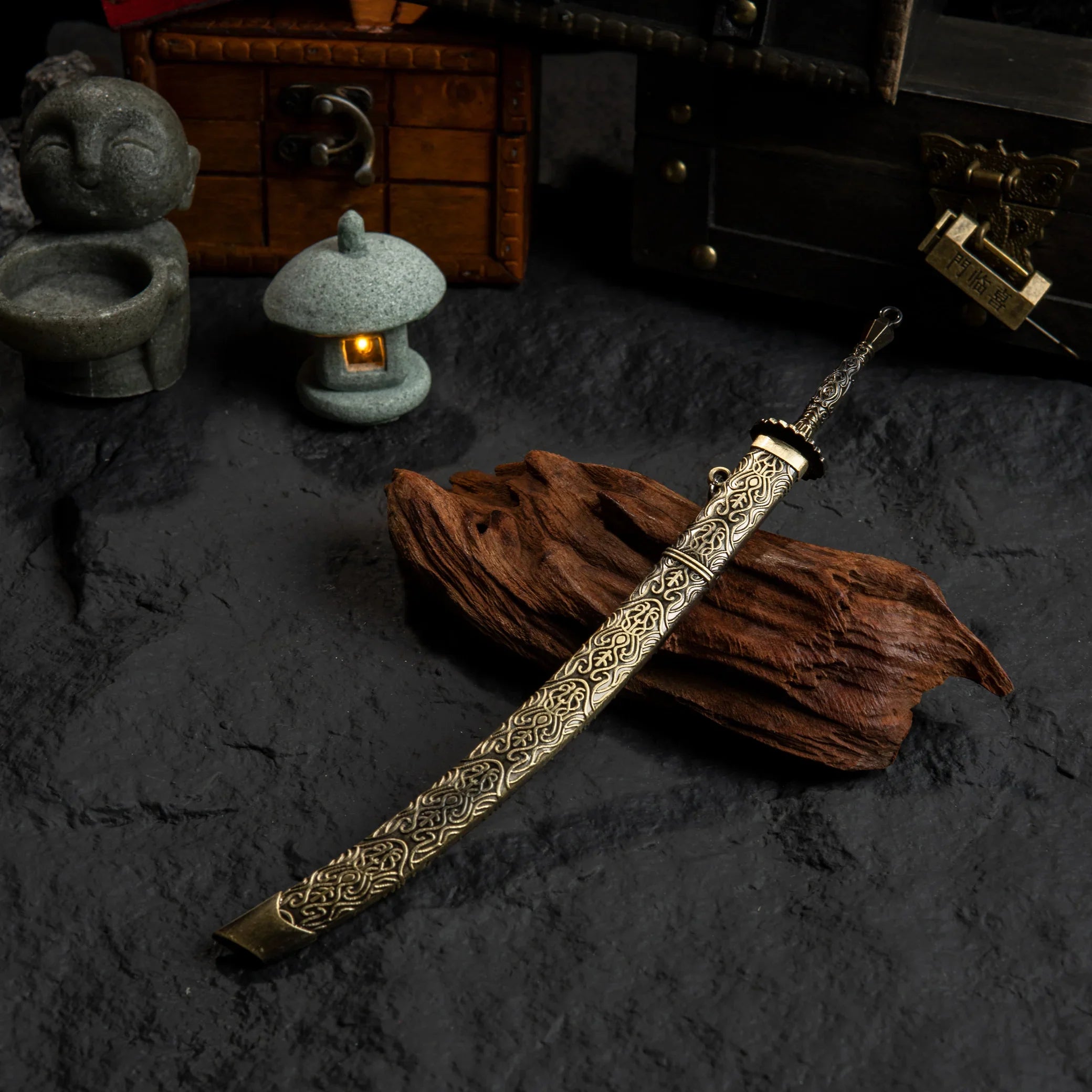 Top-down view of the Meteoric Ore Blade replica on a dark textured surface.