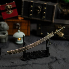 Meteoric Ore Blade displayed horizontally on a large black stand with chests in the background.