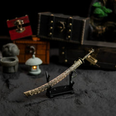 Meteoric Ore Blade replica displayed horizontally on a small stand.