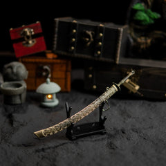 Meteoric Ore Blade replica displayed horizontally on a small stand.