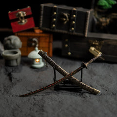 Meteoric Ore Blade sword and scabbard displayed in a crossed X-shape on a stand.