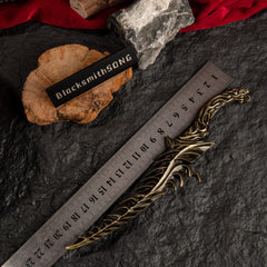 Reduvia dagger replica placed next to a ruler showing a length of approximately 20cm.