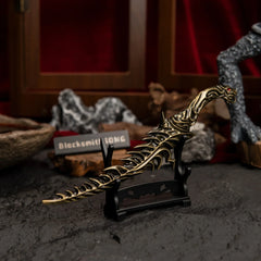 Reduvia dagger displayed on a small, simple horizontal stand.