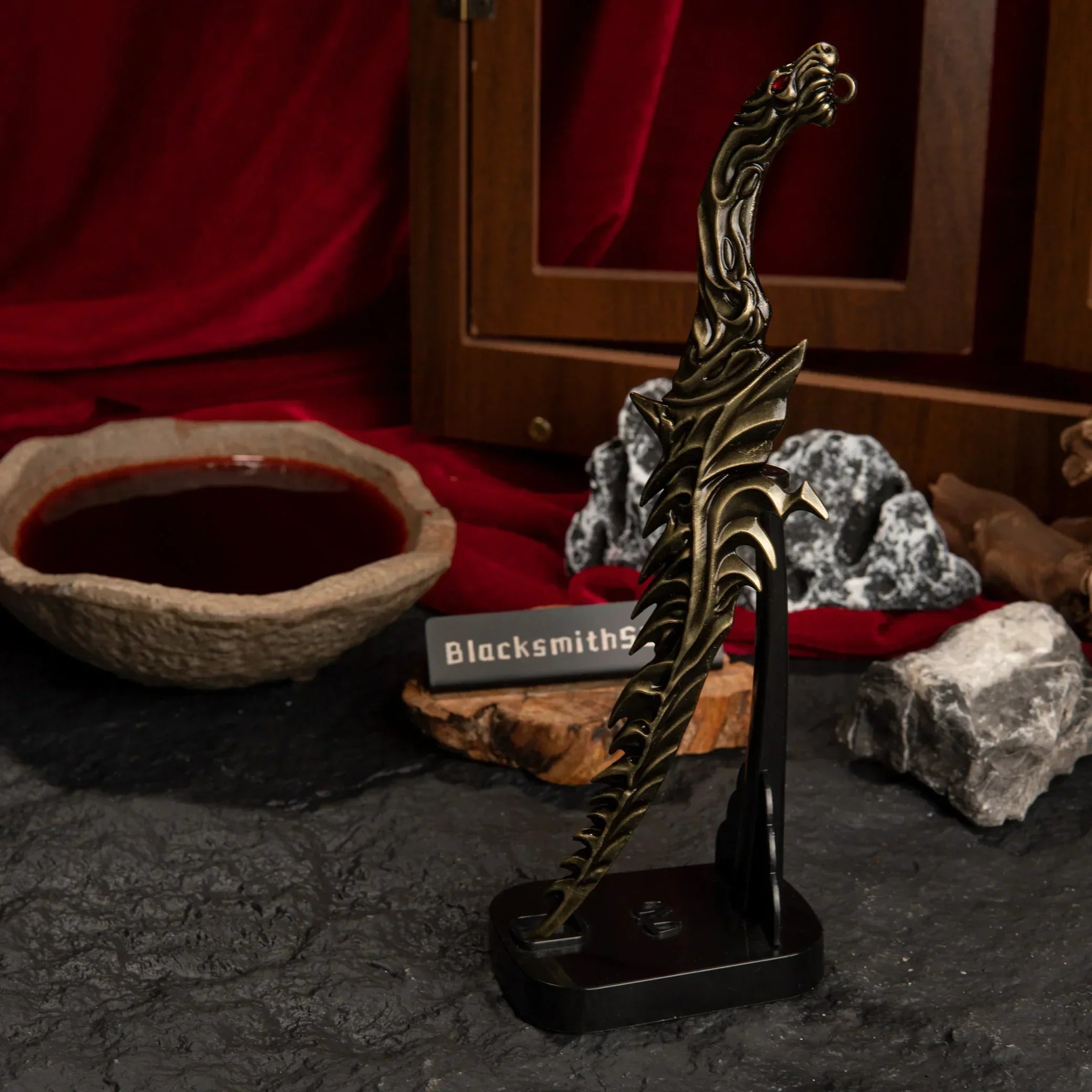 Side view of the Reduvia dagger displayed vertically on a stand.